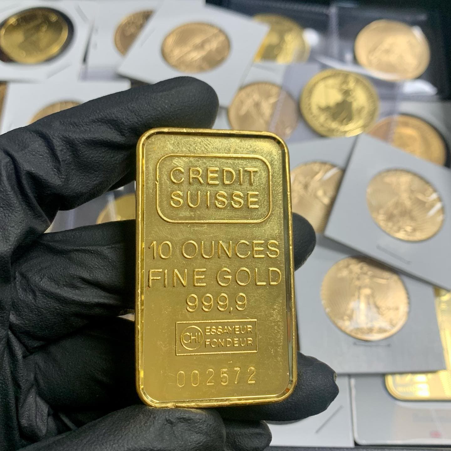 Refined gold bars stacked on the dealer counter at Bayshore Bullion Exchange.
